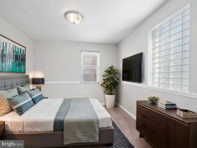 an empty room with windows and closet