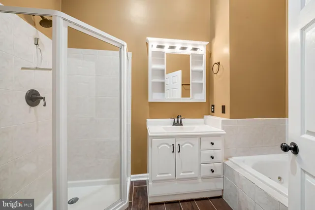 a bathroom with a bathtub and a sink
