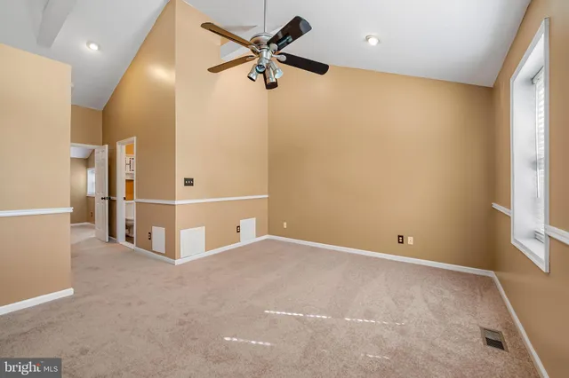 a view of a backyard with a wooden fence