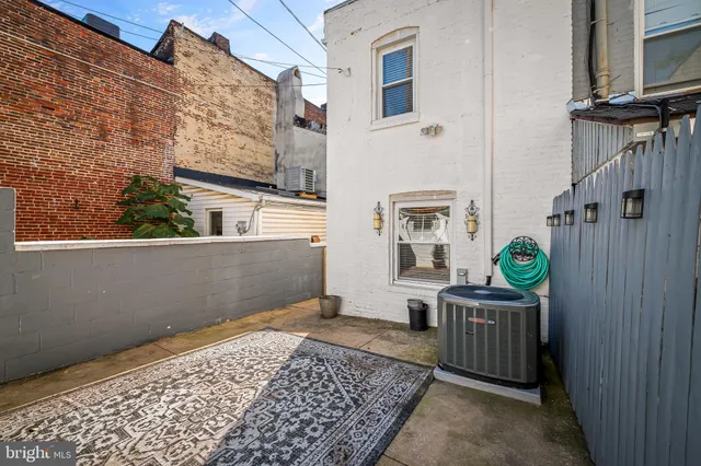 a view of a car parked in front of a house