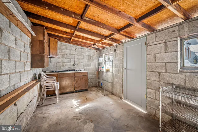 a view of a cars park in front of a building