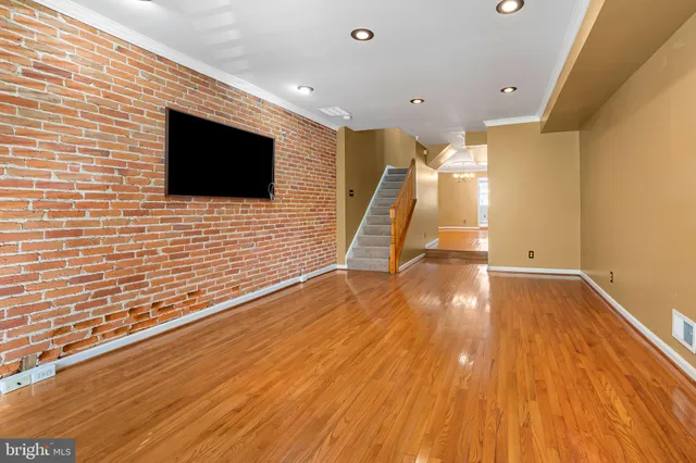 a view of a livingroom with wooden floor