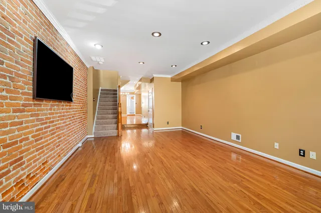 a view of a livingroom with wooden floor
