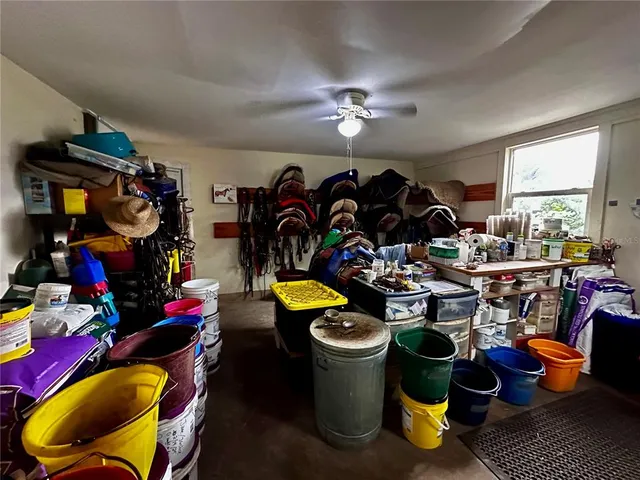 a view of swimming pool with a couches chairs and a yard