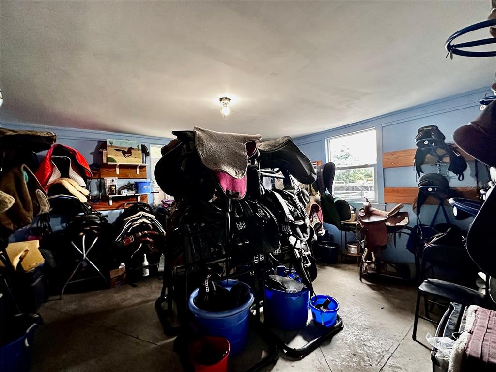 Southwest 107th Street Archer, FL 32618 - Photo 23 of 25 a view of a room with gym equipment
