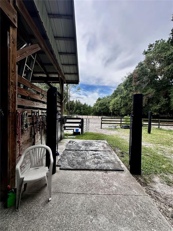 Southwest 107th Street Archer, FL 32618 - Photo 25 of 25 a view of swimming pool with a couches chairs and a yard