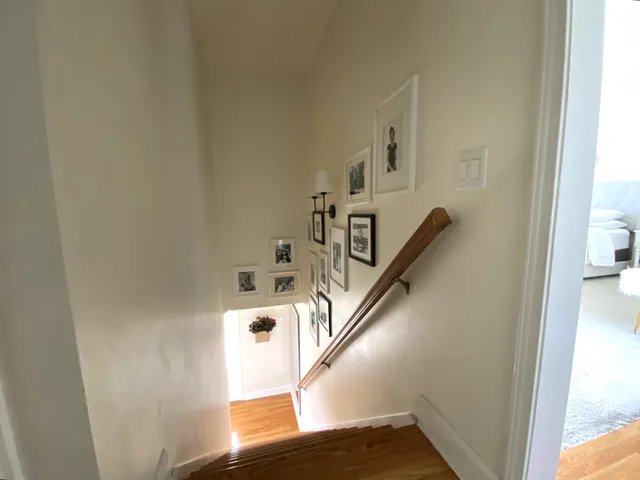 a bedroom with a bed and cabinets