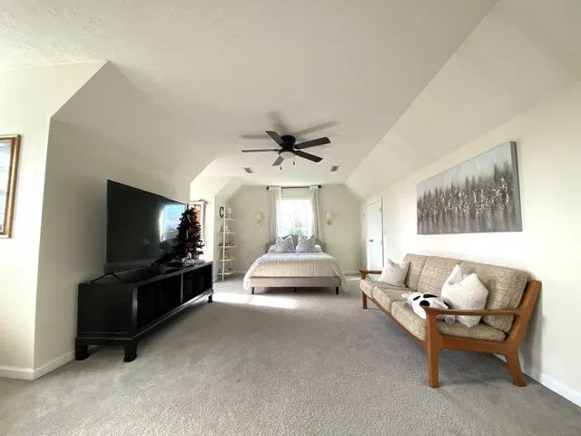 a spacious bathroom with a granite countertop sink and a mirror