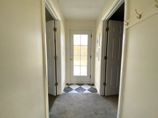 a spacious bathroom with a double vanity sink toilet and a tub