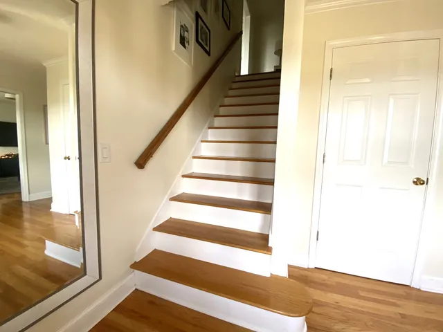 a living room with a couch and large windows