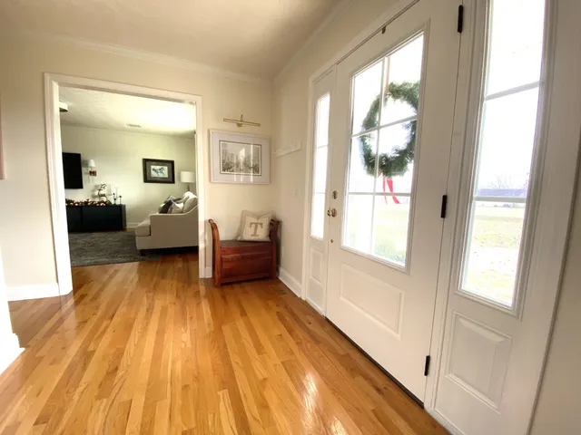 a bathroom with a toilet and a window