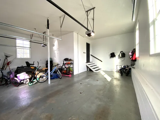 a bedroom with a bed and a lamp