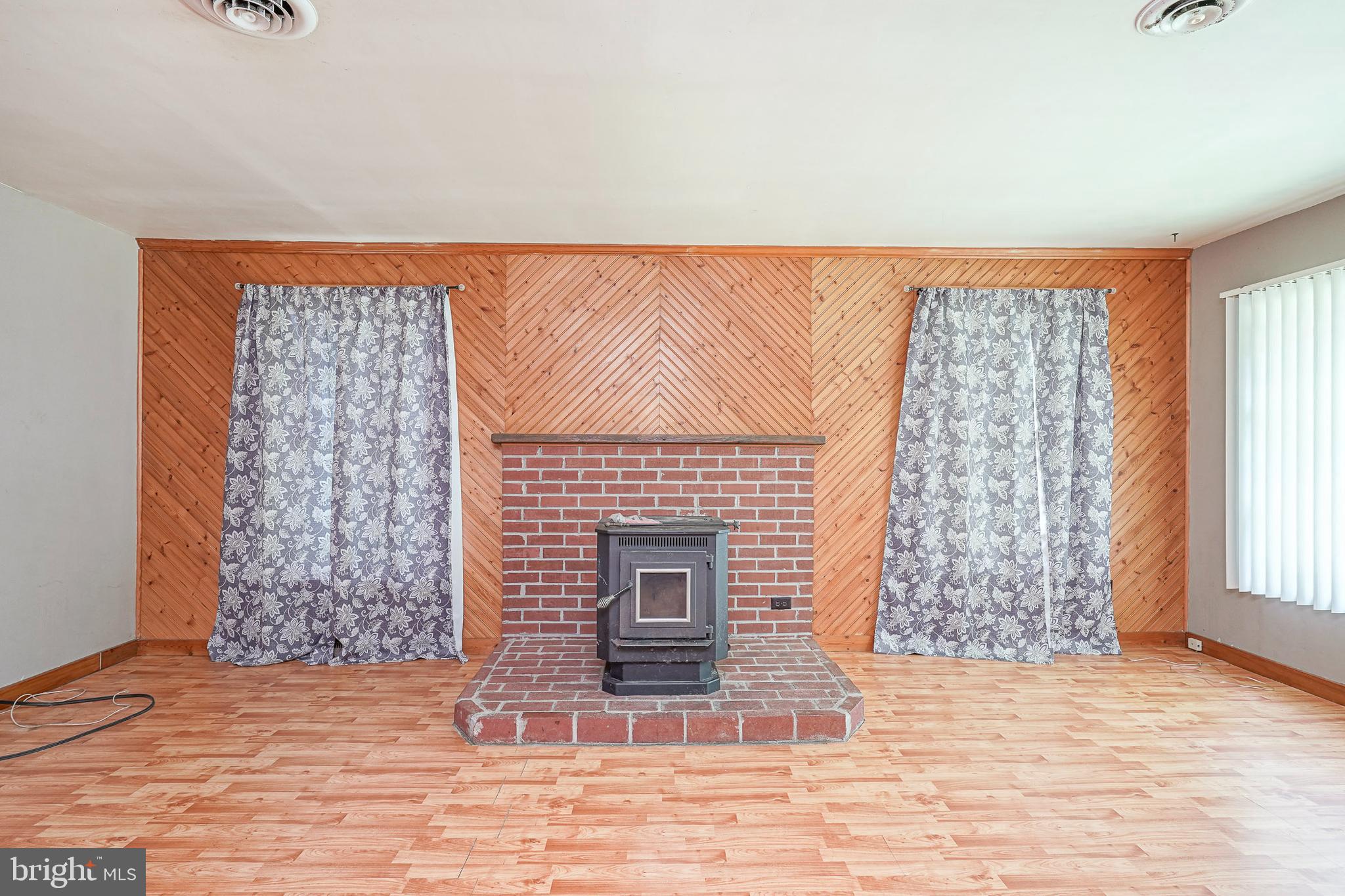 69 Buckhorn Road Salem, NJ 08079 - Photo 11 of 38 a living room with a fireplace
