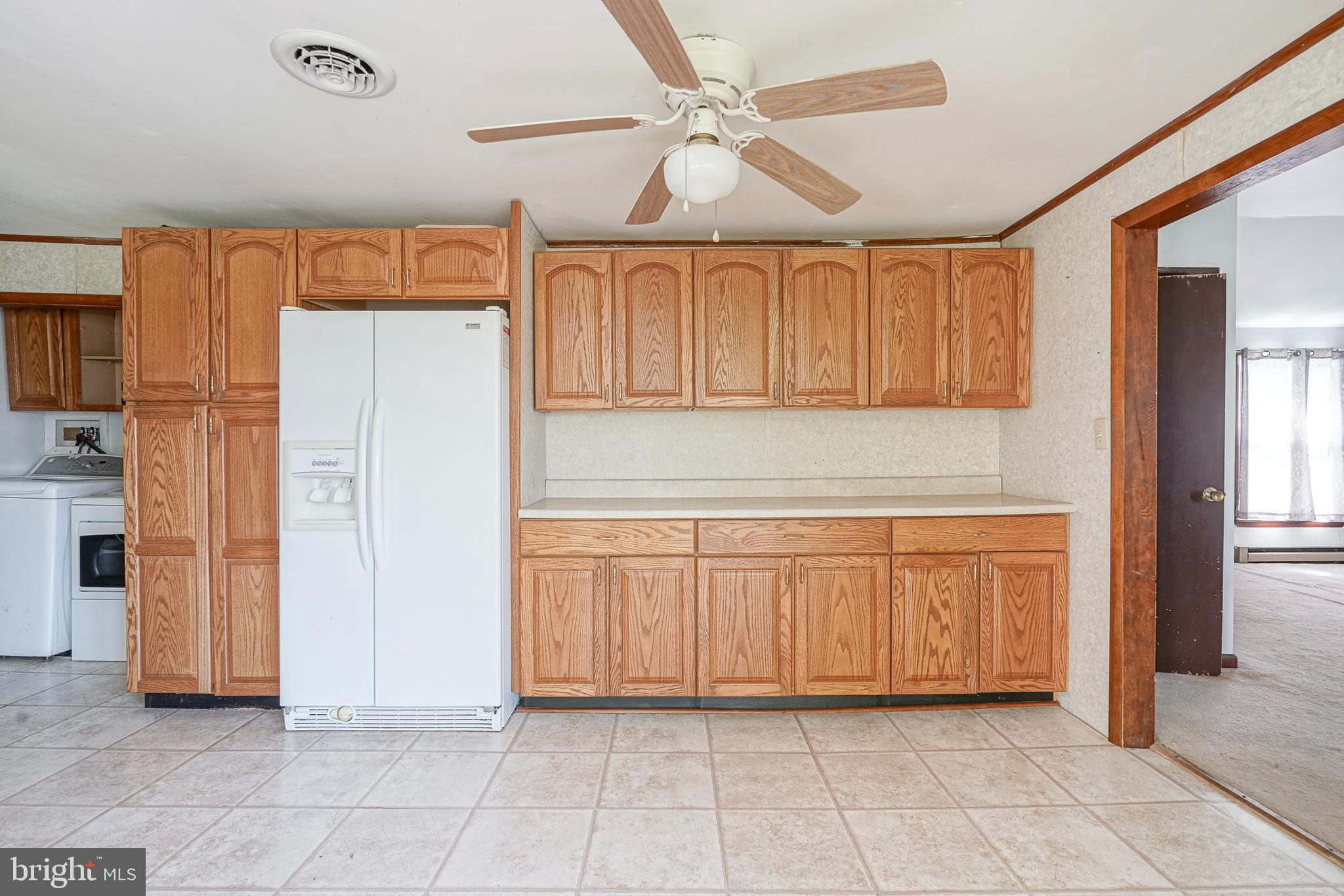 69 Buckhorn Road Salem, NJ 08079 - Photo 14 of 38 a view of a kitchen with cabinet and a refrigerator
