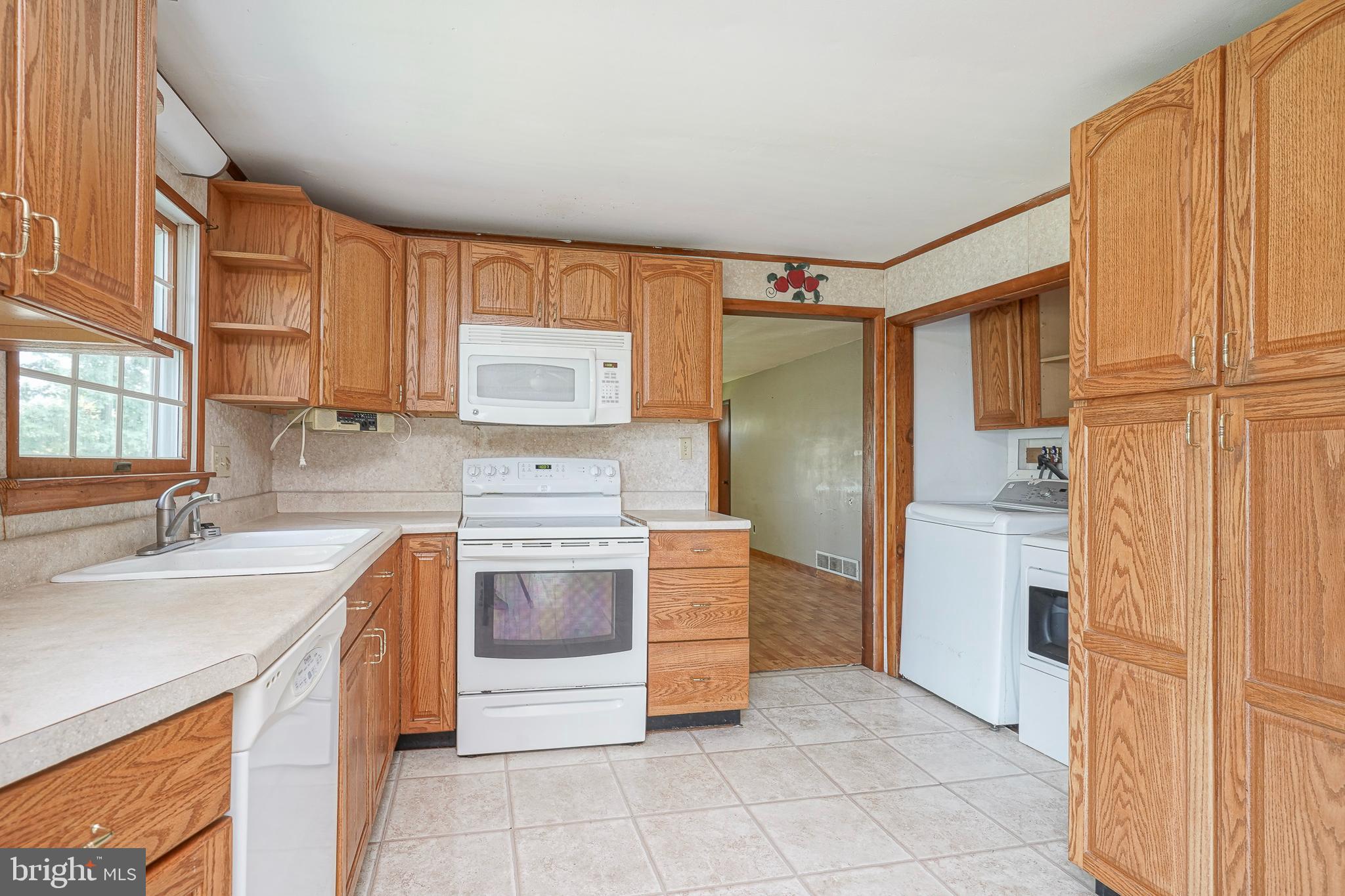 69 Buckhorn Road Salem, NJ 08079 - Photo 16 of 38 a kitchen with stainless steel appliances granite countertop a refrigerator sink and stove
