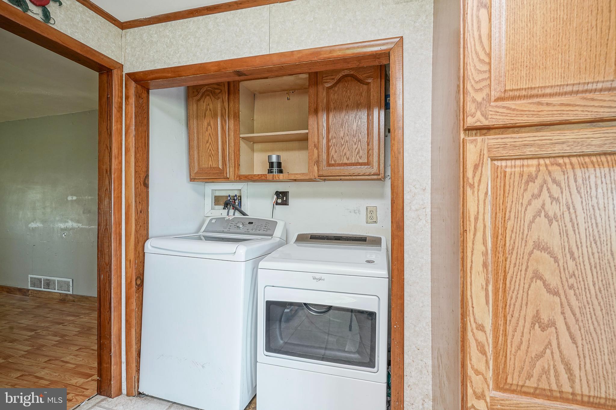 69 Buckhorn Road Salem, NJ 08079 - Photo 17 of 38 a utility room with dryer and washer