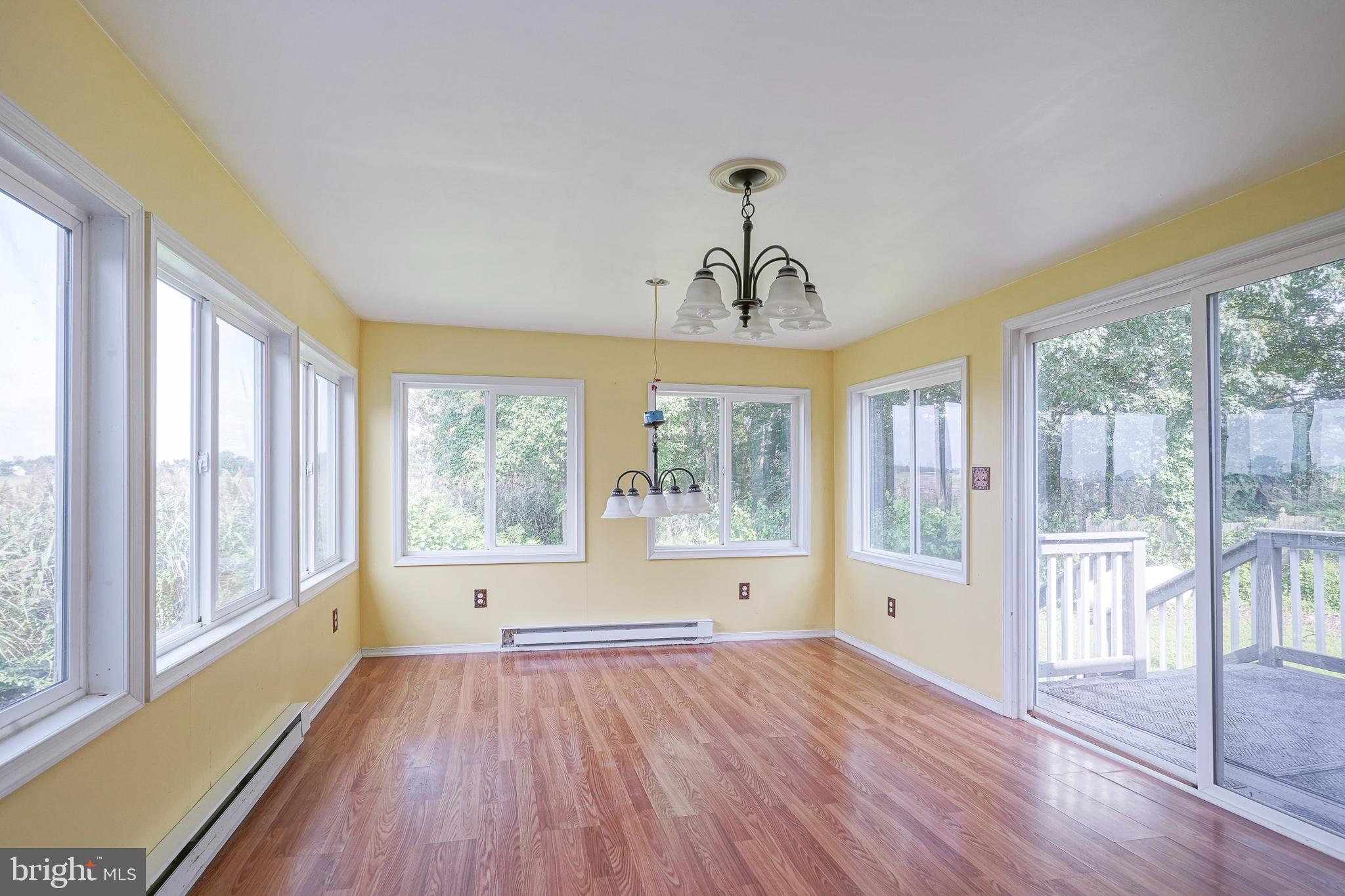 69 Buckhorn Road Salem, NJ 08079 - Photo 18 of 38 a view of empty room with wooden floor and fan
