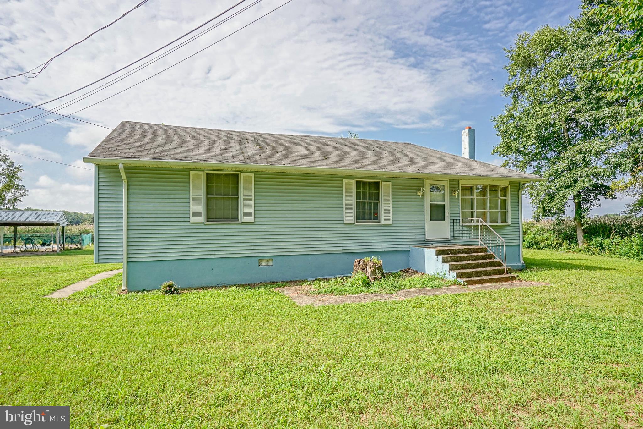 69 Buckhorn Road Salem, NJ 08079 - Photo 5 of 38 a front view of a house with a yard