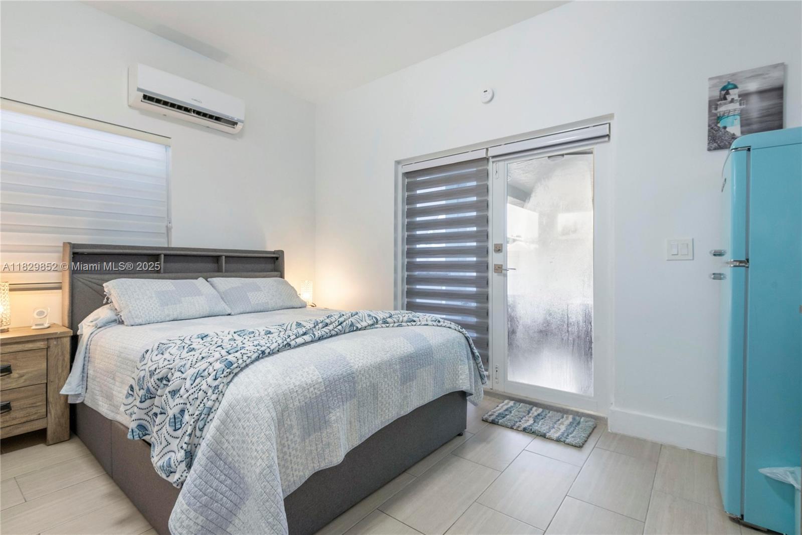 325 Calusa Street Key Largo, FL 33037 - Photo 14 of 17 a bedroom with a bed and a window