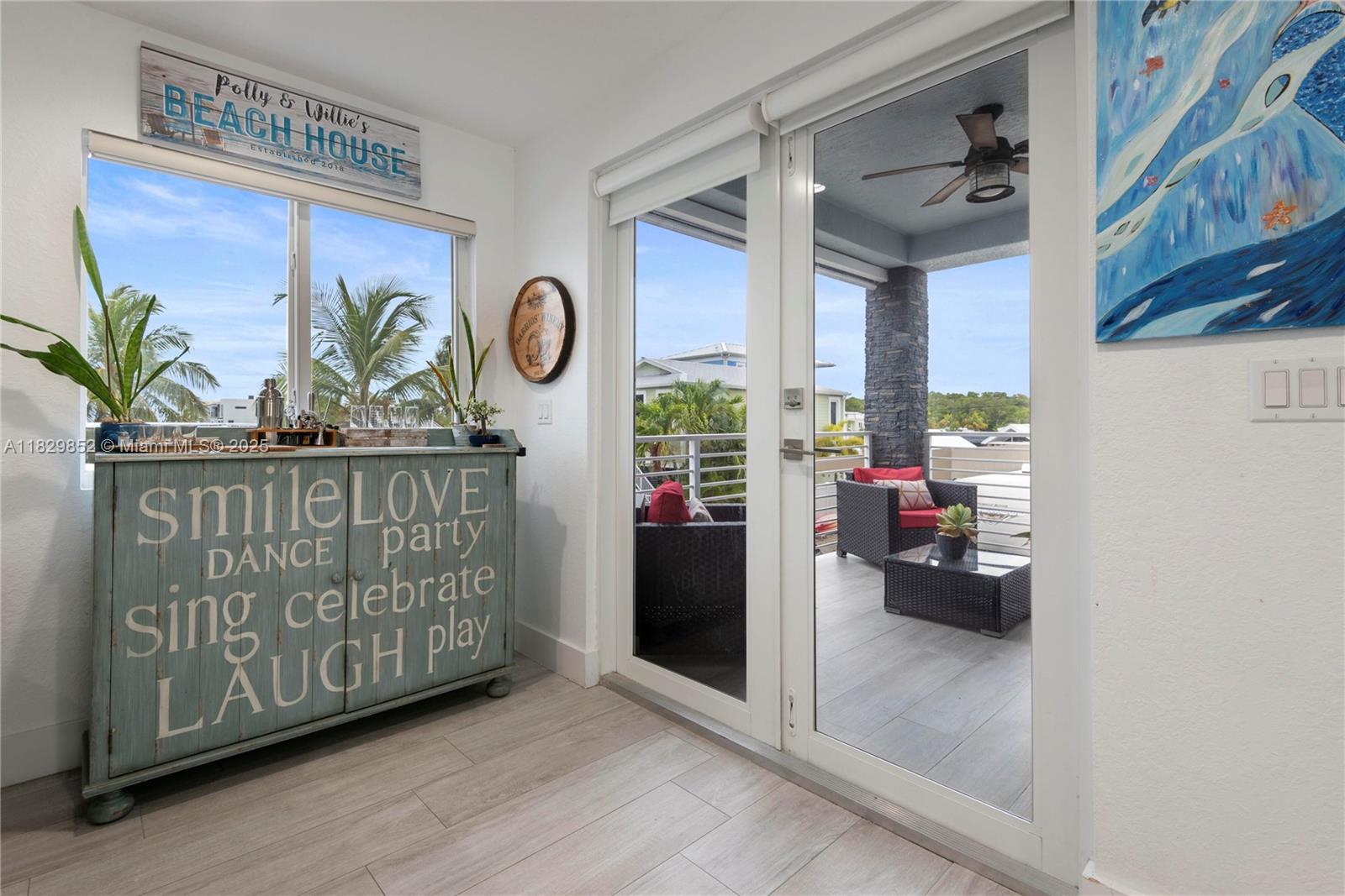 325 Calusa Street Key Largo, FL 33037 - Photo 4 of 17 a living room with furniture and a potted plant