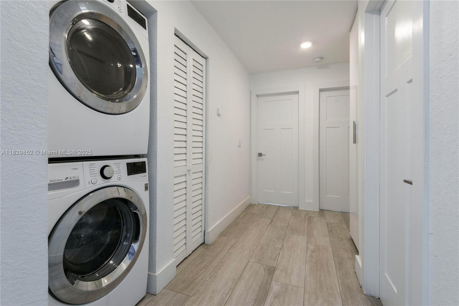 325 Calusa Street Key Largo, FL 33037 - Photo 7 of 17 a view of a hallway with washer and dryer