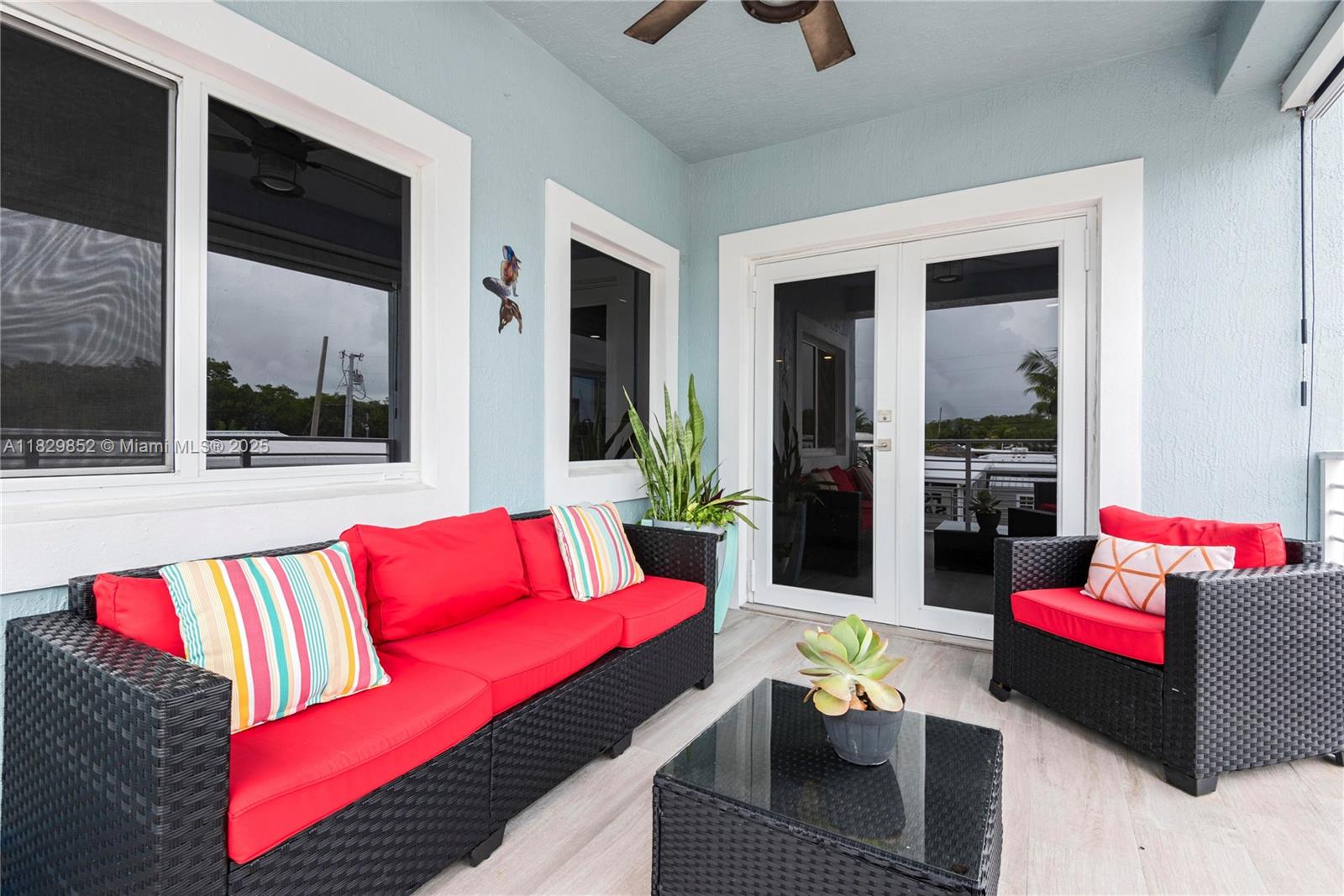 325 Calusa Street Key Largo, FL 33037 - Photo 8 of 17 a outdoor living space with furniture and a potted plant