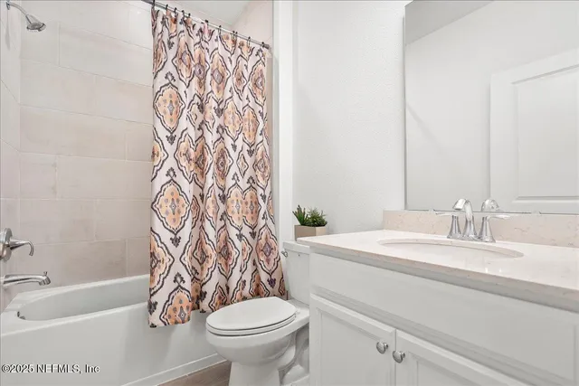 a bathroom with a sink a toilet and a bathtub