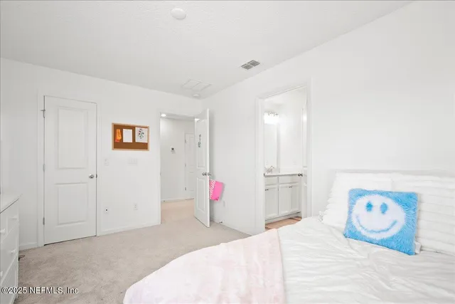 a bedroom with a bed and a cabinets