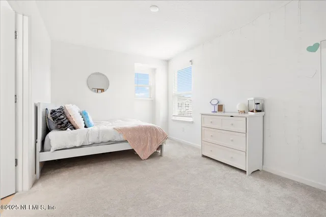 a room with a bed and a night stand