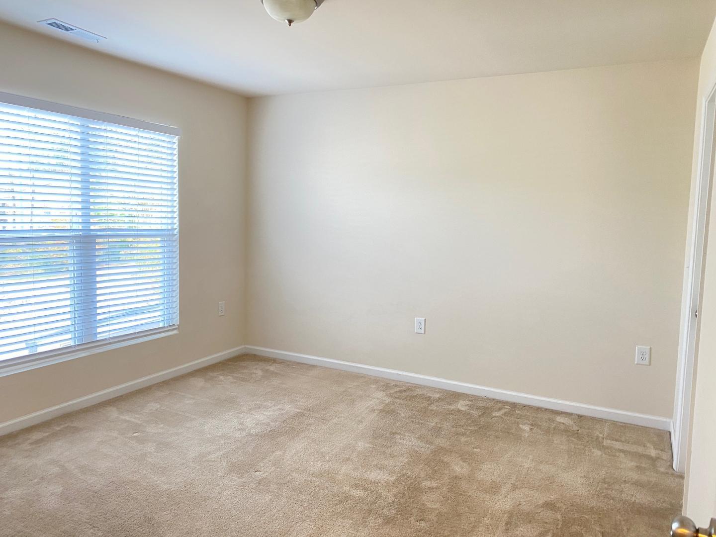 1005 Saffron Loop Durham, NC 27713 - Photo 16 of 26 an empty room with a window