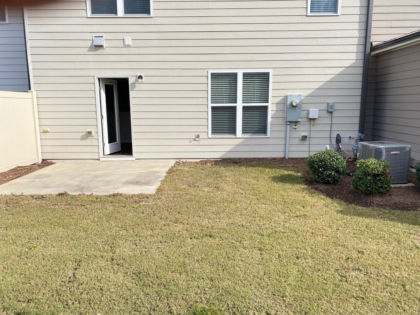 1005 Saffron Loop Durham, NC 27713 - Photo 18 of 26 a view of a white house with a yard