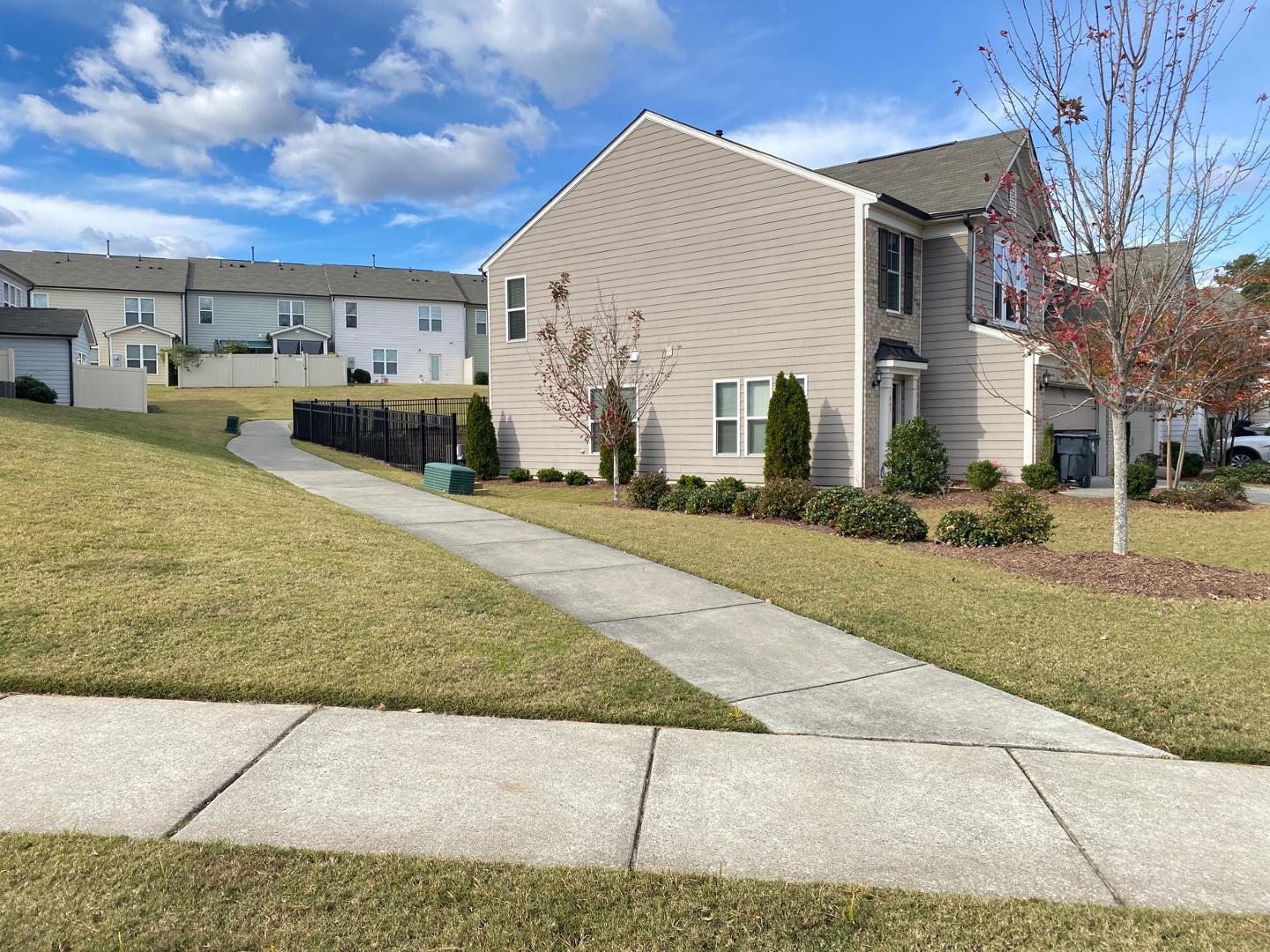 1005 Saffron Loop Durham, NC 27713 - Photo 20 of 26 a view of a house with a patio