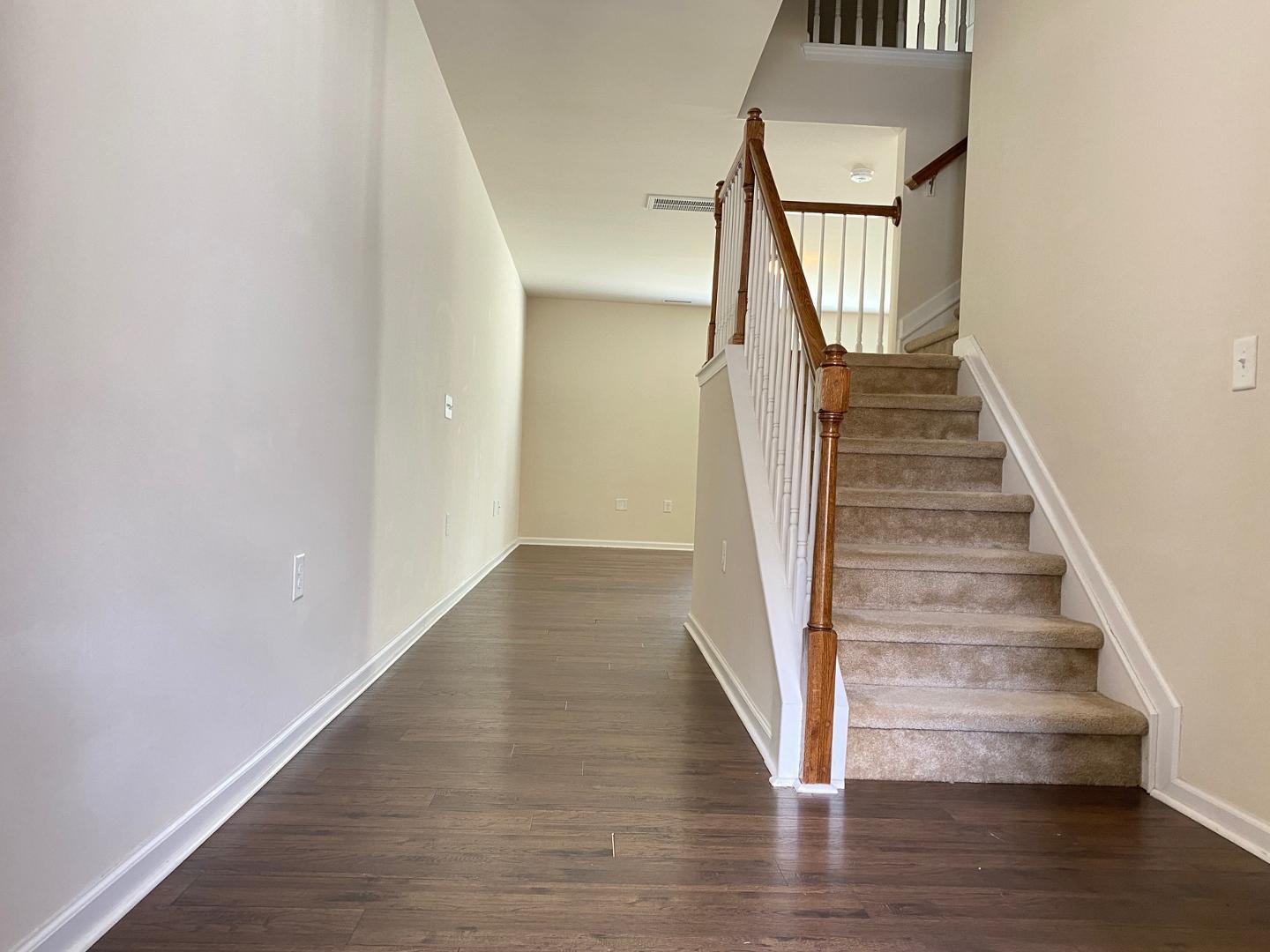 1005 Saffron Loop Durham, NC 27713 - Photo 3 of 26 a view of entryway and hall with wooden floor