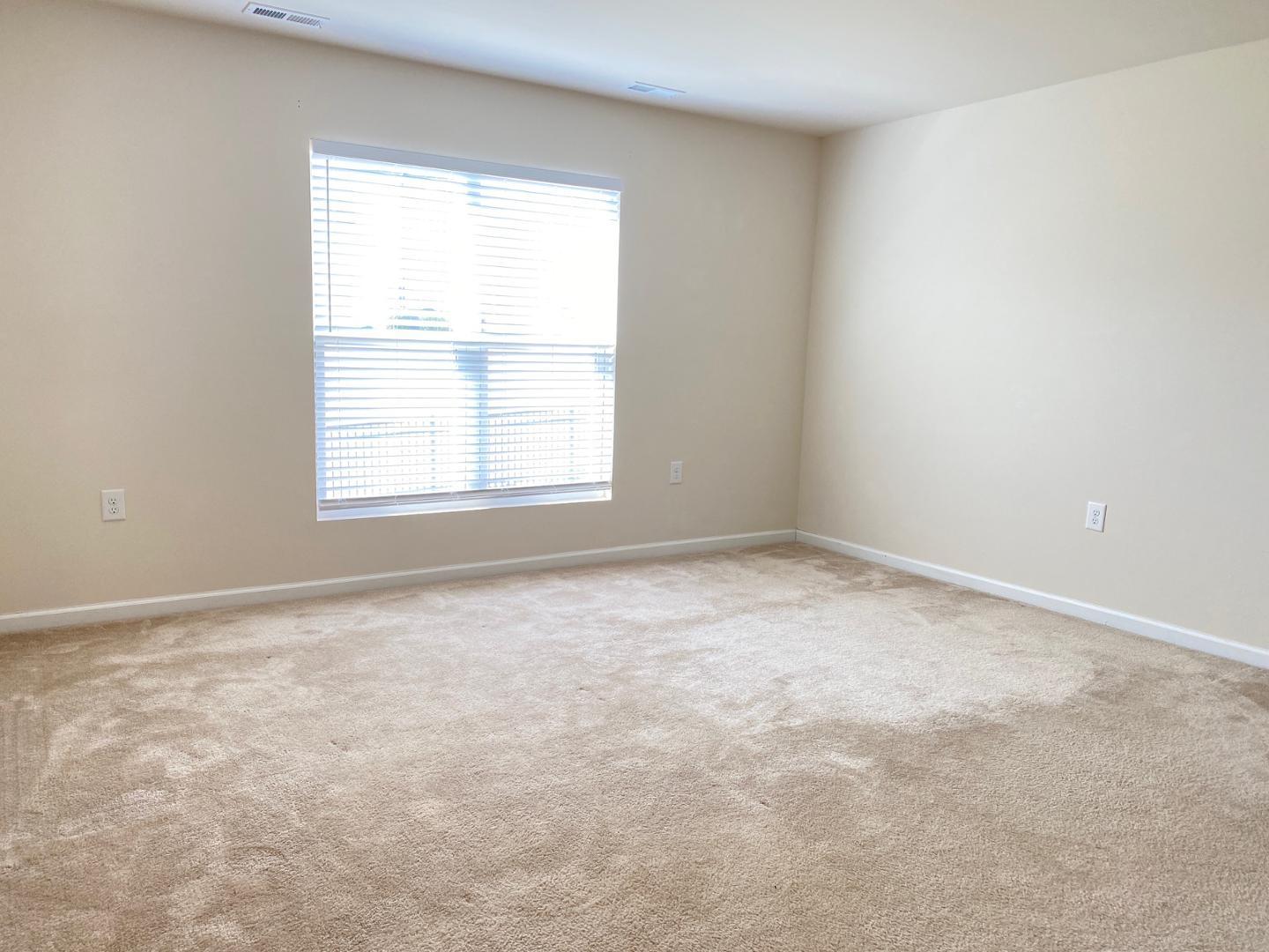 1005 Saffron Loop Durham, NC 27713 - Photo 10 of 26 an empty room with a window