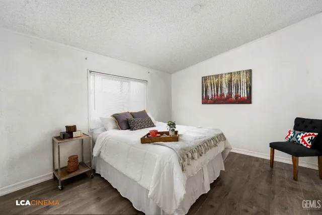 a bedroom with bed and a window