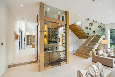 a view of entryway and hall with a living room