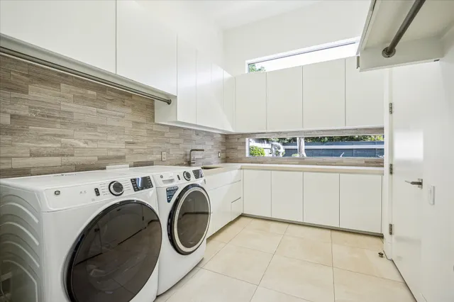 a utility room with dryer and washer