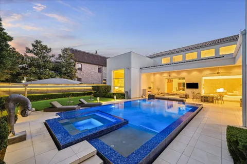 a view of a swimming pool with a lounge chair