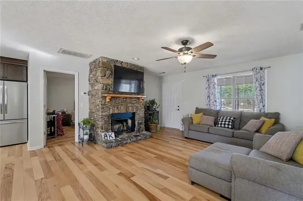 a living room with furniture and a fireplace