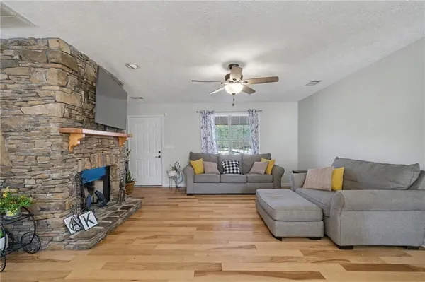 a living room with furniture and a fireplace