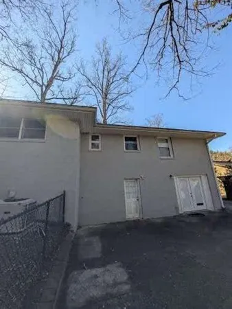 a view of a house with a tree