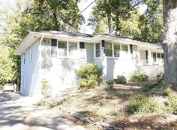 1216 Beech Haven Road Northeast Atlanta, GA 30324 - Photo 2 of 18 a front view of a house with a yard