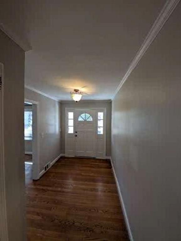 1216 Beech Haven Road Northeast Atlanta, GA 30324 - Photo 3 of 18 a view of an empty room with wooden floor and a window
