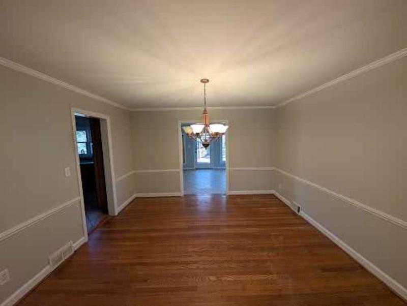 1216 Beech Haven Road Northeast Atlanta, GA 30324 - Photo 5 of 18 a view of a room with wooden floor and window