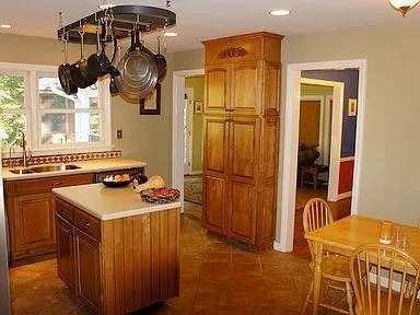 a kitchen with a stove and a refrigerator