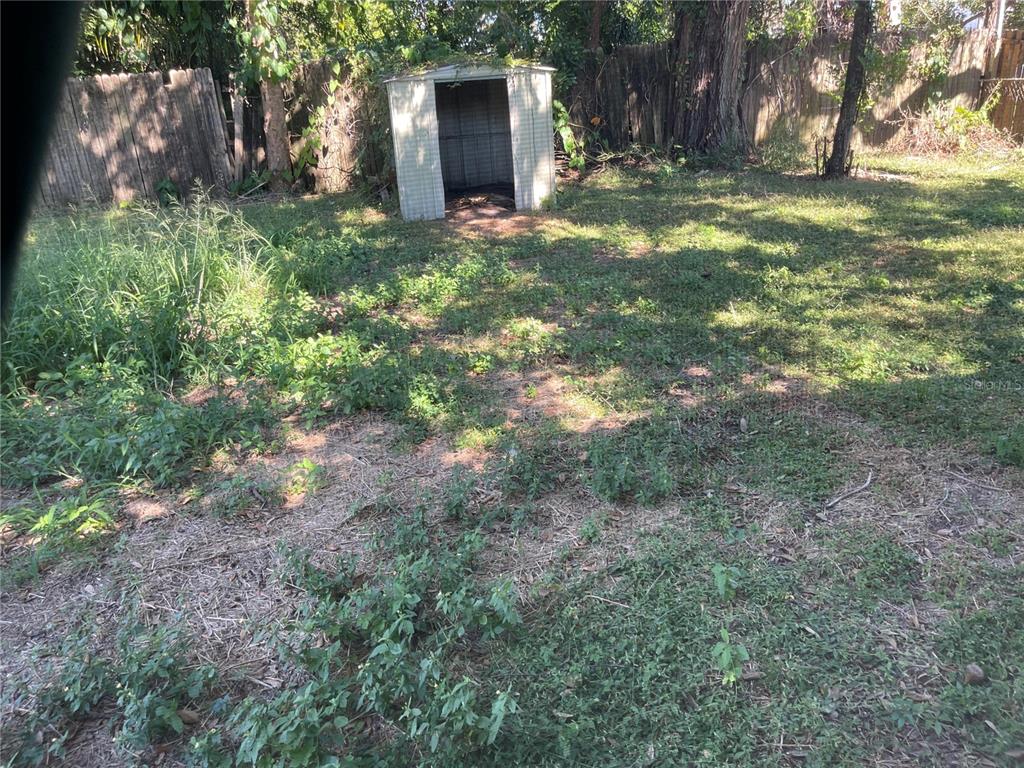 3076 Grand View Avenue Clearwater, FL 33759 - Photo 15 of 15 a view of a yard with plants and trees