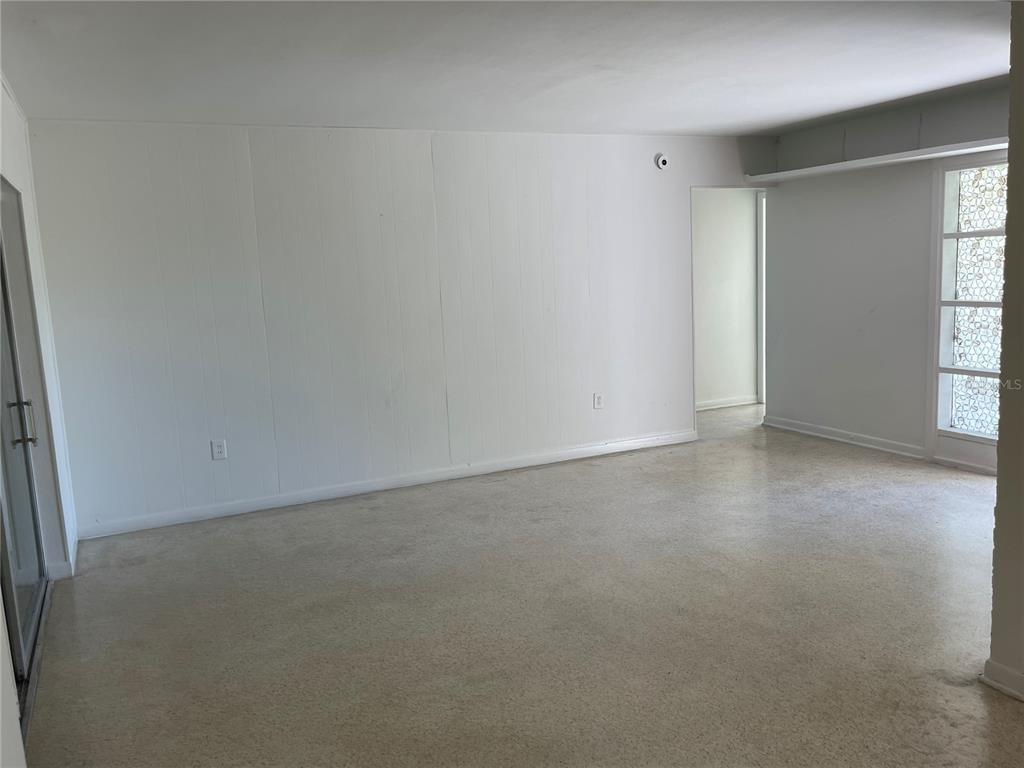 3076 Grand View Avenue Clearwater, FL 33759 - Photo 4 of 15 an empty room with windows and closet