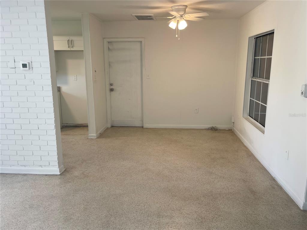 3076 Grand View Avenue Clearwater, FL 33759 - Photo 6 of 15 a view of an empty room with a window