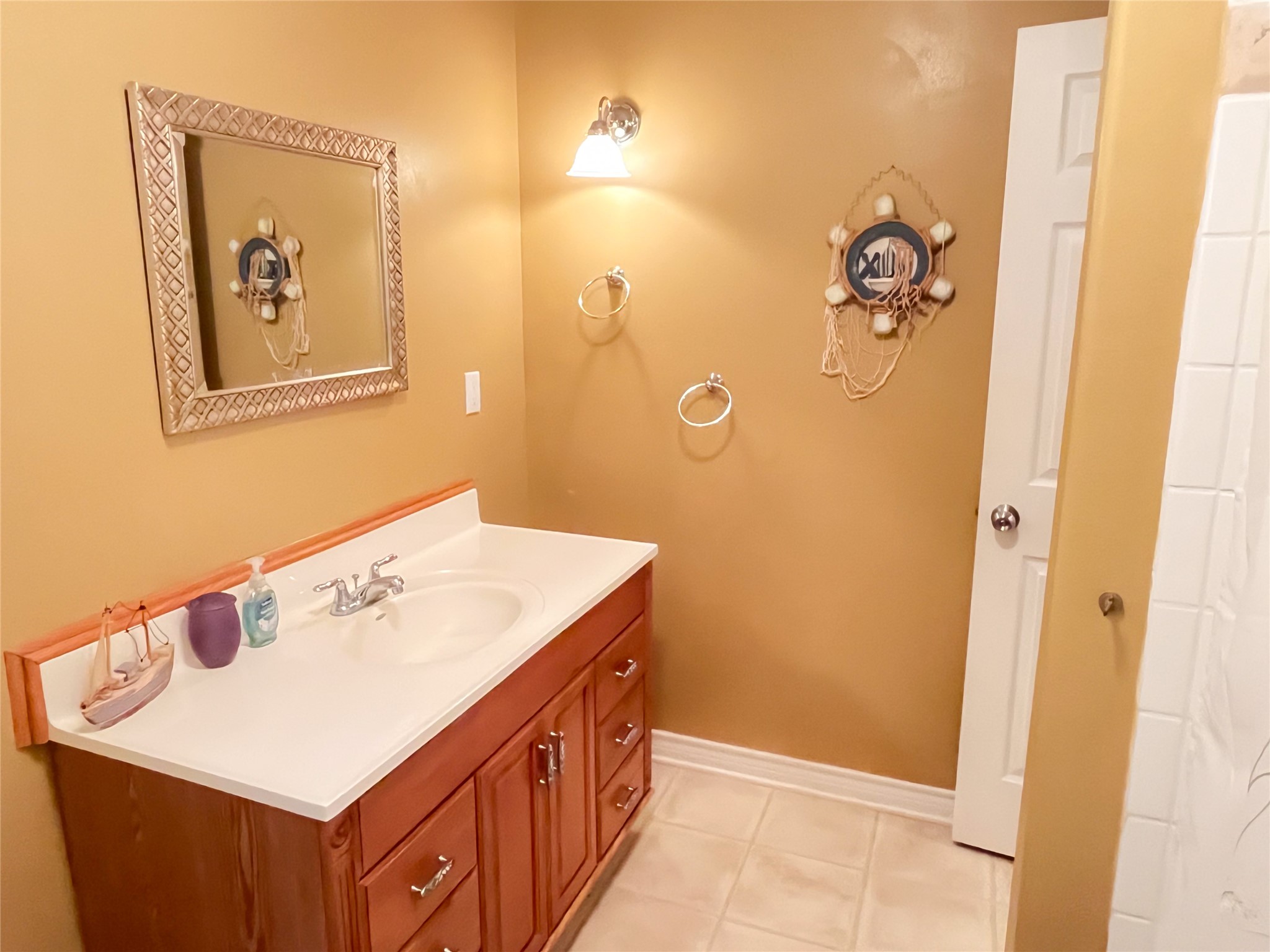 231 Memphis Belle Trinity, TX 75862 - Photo 34 of 47 a bathroom with a sink mirror and vanity