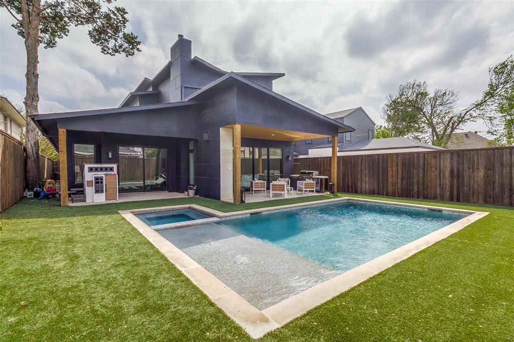 6215 Llano Avenue Dallas, TX 75214 - Photo 11 of 38 a view of a house with backyard and a slide
